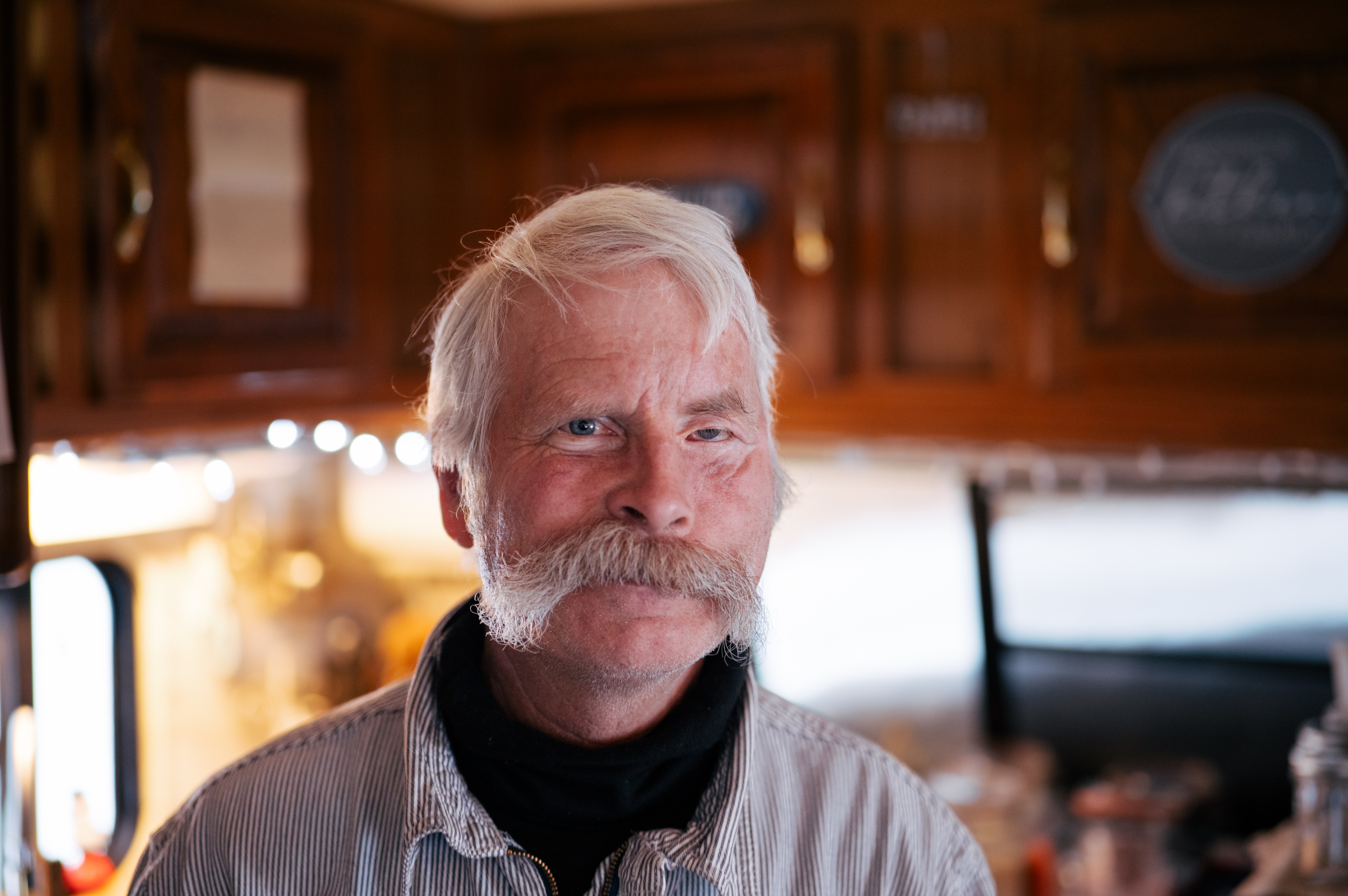 Steve Braun inside a log home